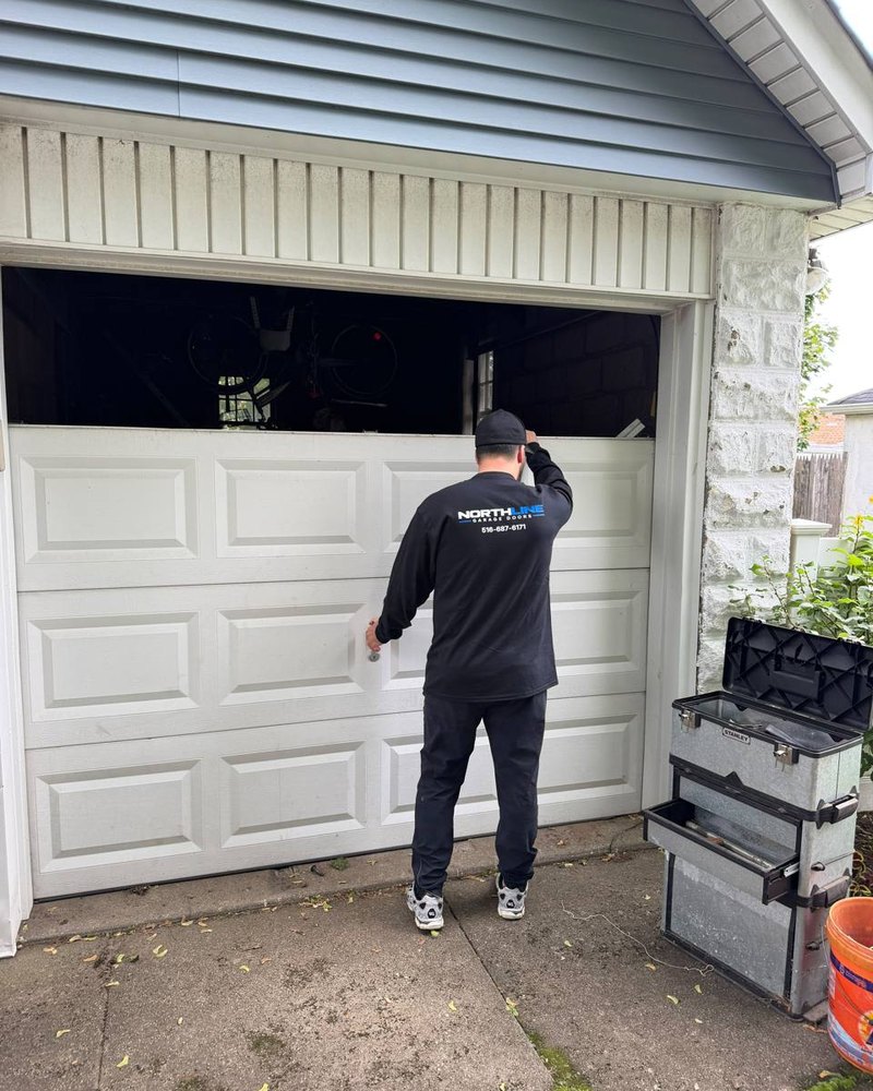 NorthLine technician working on a residential garage door